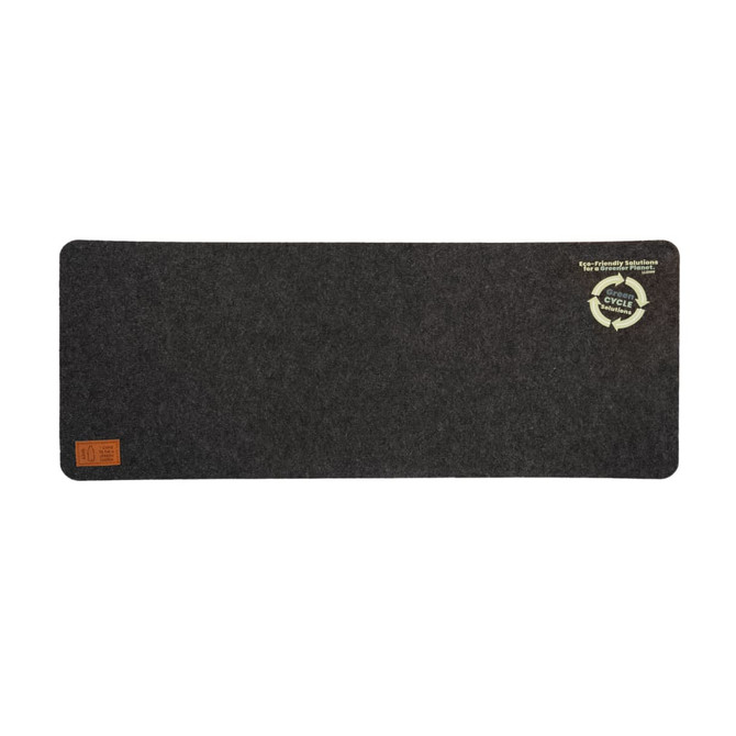 A dark grey desk mat with a textured surface and a circular logo in the corner.