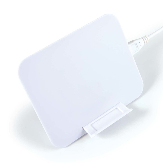A wireless charger in white, featuring a rectangular design with a attached cable.