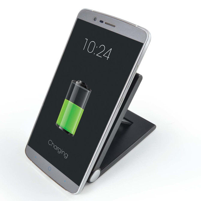 A wireless charger in black with a silver phone on it, displaying a charging battery icon.