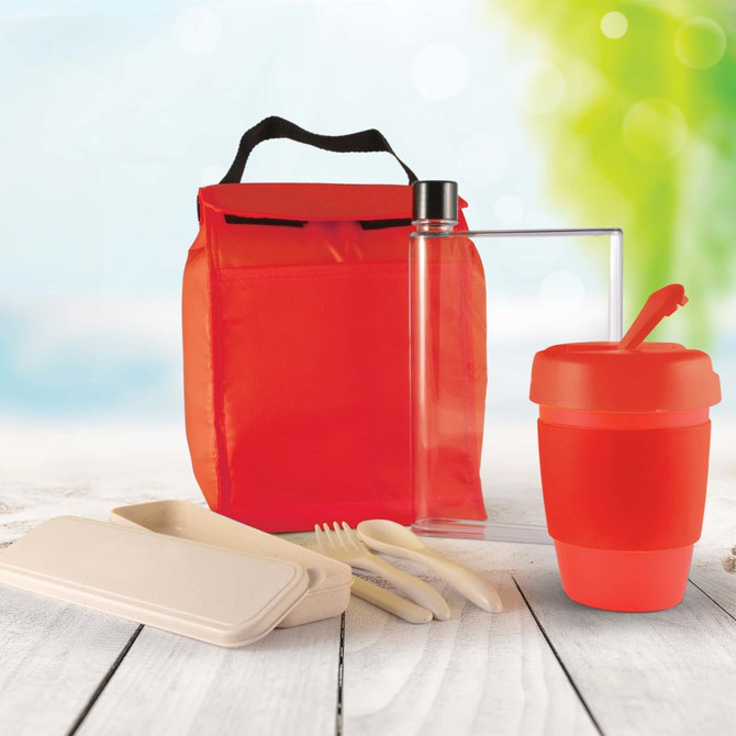 A red picnic pack with a drink bottle, reusable cup, utensils, and containers. Includes a logo on the bag.