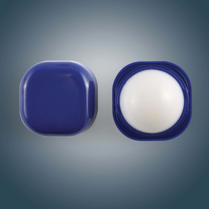 A Cube Lip Balm with a rounded, smooth white balm inside a square navy blue container, featuring a twist-off lid.
