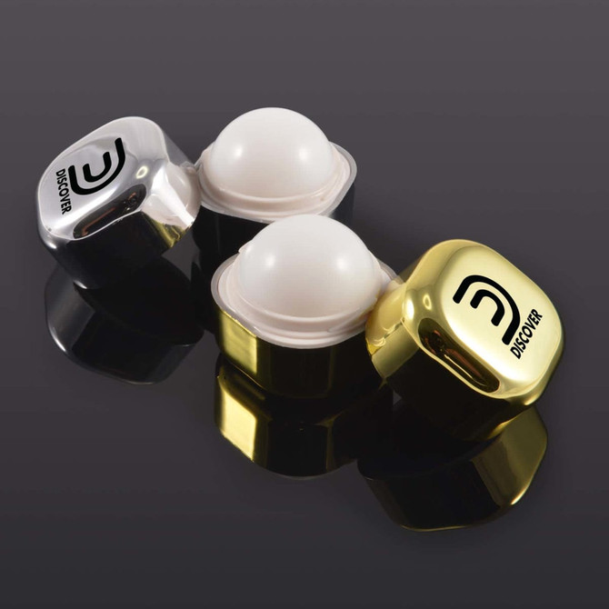 A set of two lip balm containers, one with a shiny gold cap and the other with a sleek silver cap, both featuring a logo.