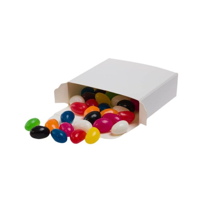 Assorted jelly beans in various colors spilling from a white box.