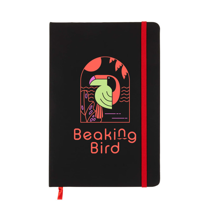 A black A5 notebook with a red elastic band, featuring a colorful bird design on the cover and a logo.