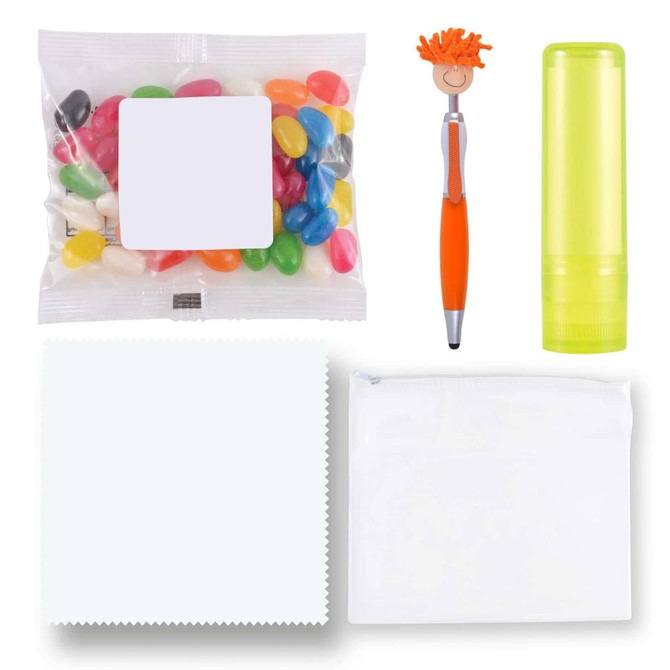 An assortment of colorful jelly beans, an orange and silver pen, a lime green lip balm, a white cloth, and a clear pouch.