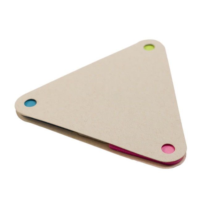 A triangular sticky notes holder in natural color with blue, pink, and green accent dots on the corners.