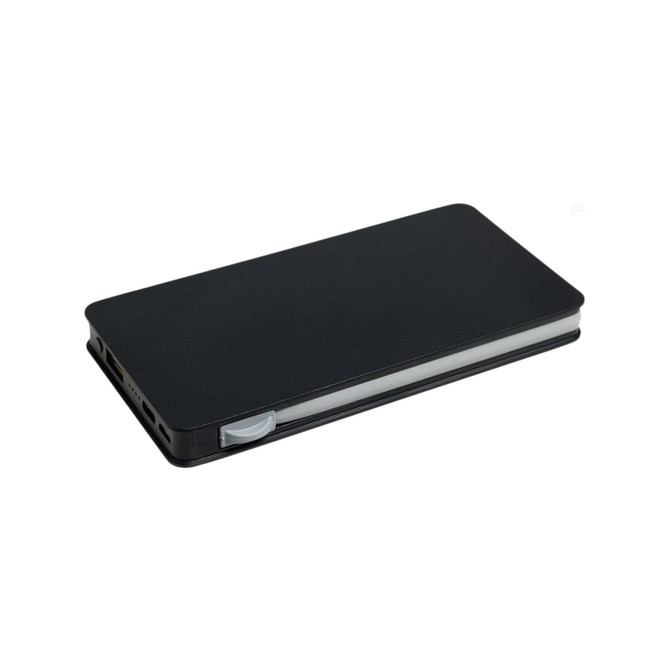 A black wireless power bank with a sleek design, featuring side ports and an integrated charging pad.