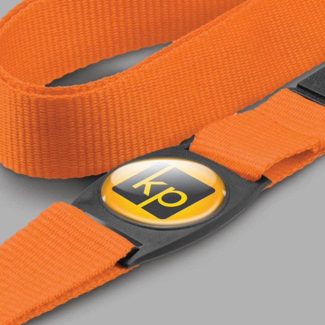 An orange strap with a circular label featuring a logo in black and yellow.