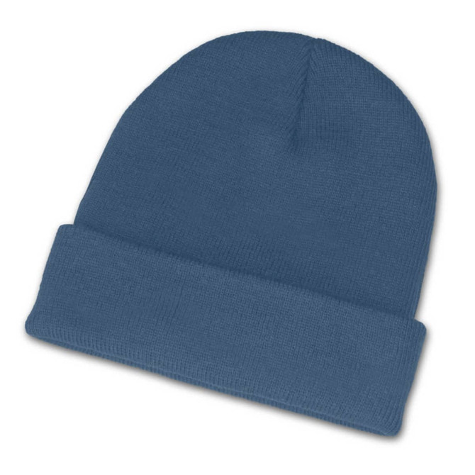 A blue beanie featuring a folded cuff design, perfect for providing warmth.
