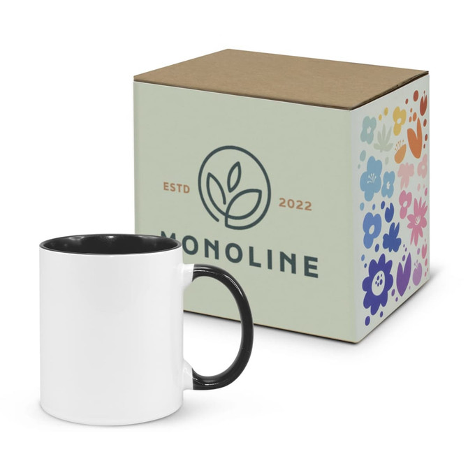 A two-tone coffee mug in white with a black interior, accompanied by a decorative box featuring floral designs.