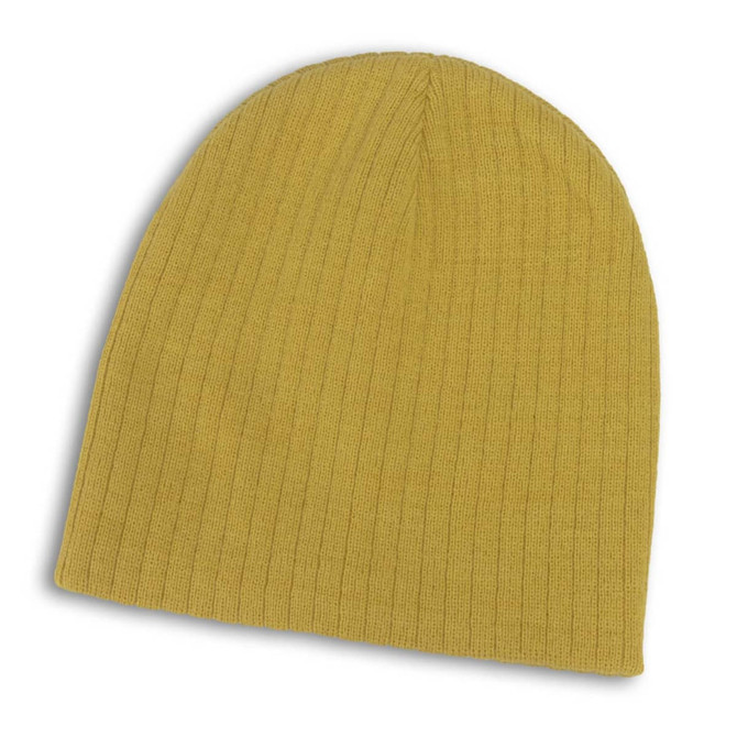 A Nebraska Cable Knit Beanie in a vibrant mustard yellow color, featuring a textured knit design.
