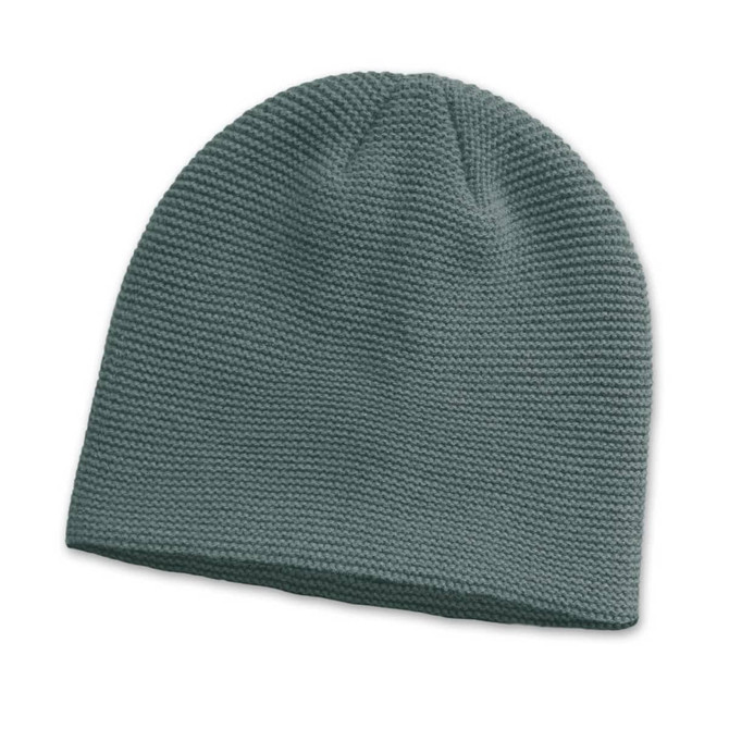A green knitted beanie with a textured pattern and a logo on the side.