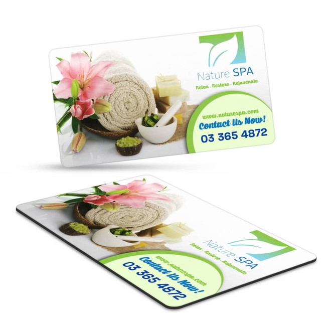 A rectangular fridge magnet in vibrant colours featuring spa imagery and a logo, with floral elements and contact details.