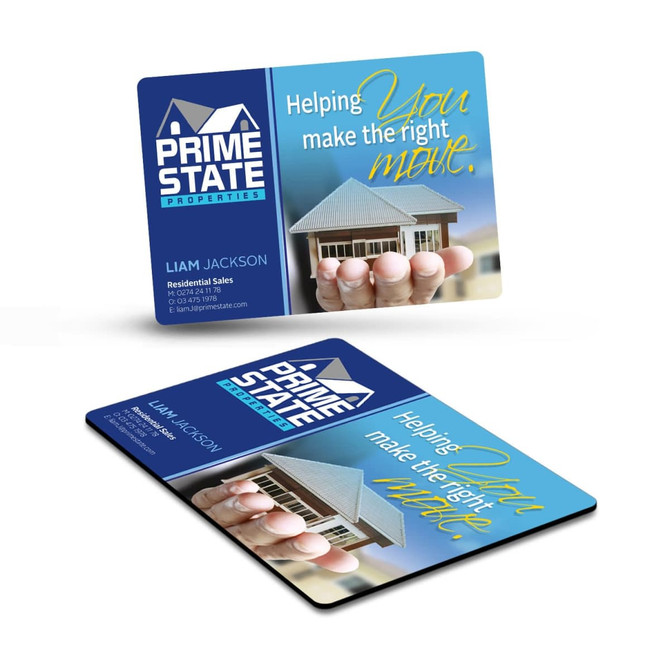 A rectangular fridge magnet featuring a blue and white design with a logo and text, showcasing a house and hand graphic.