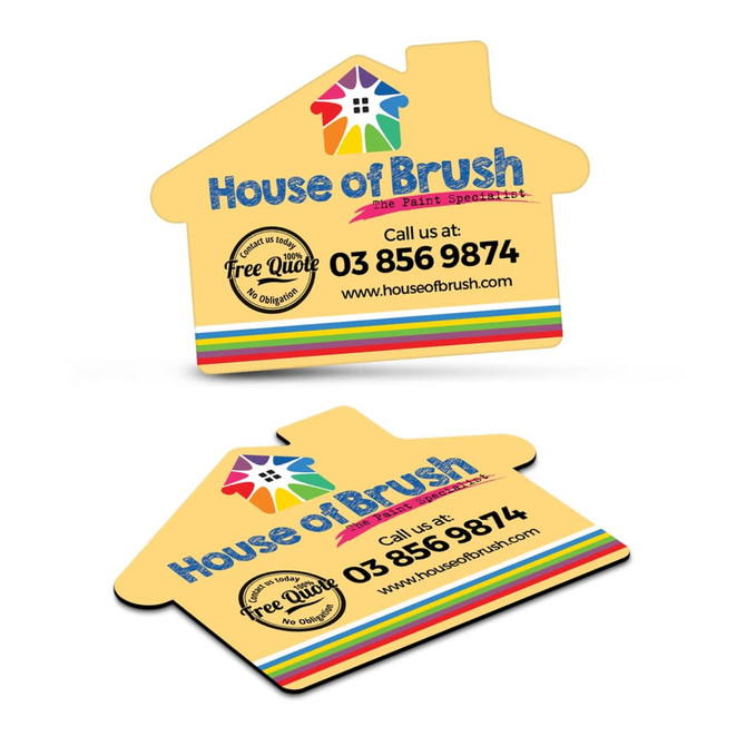 A house-shaped fridge magnet in yellow features multicoloured stripes and includes a logo, phone number, and website.