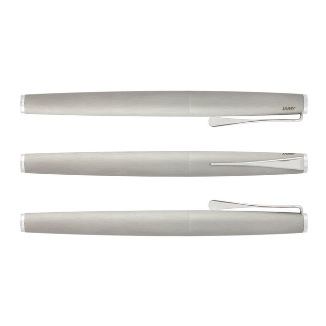 A metallic silver Lamy Studio Rolling Ball Pen displayed from multiple angles, featuring a sleek design and clip.