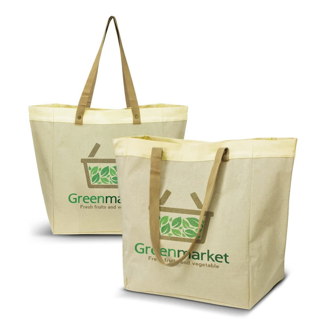A beige tote bag with light yellow handles and a logo. Two bags displayed, featuring a green market design.