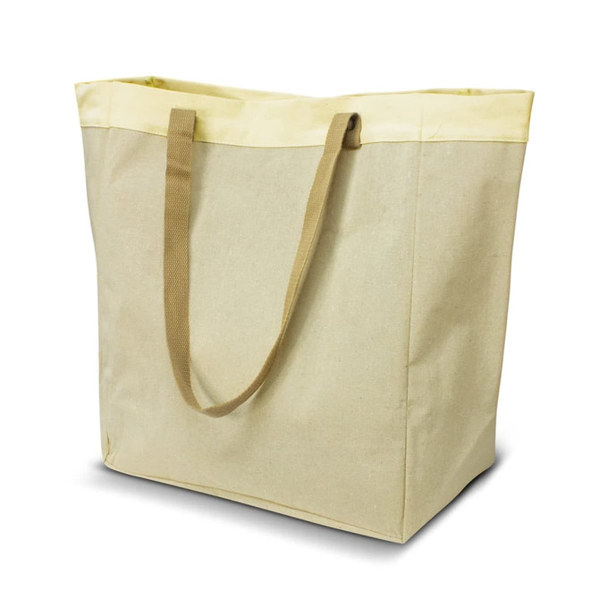 A large market tote bag in beige with yellow trim and sturdy brown handles. It features a logo.
