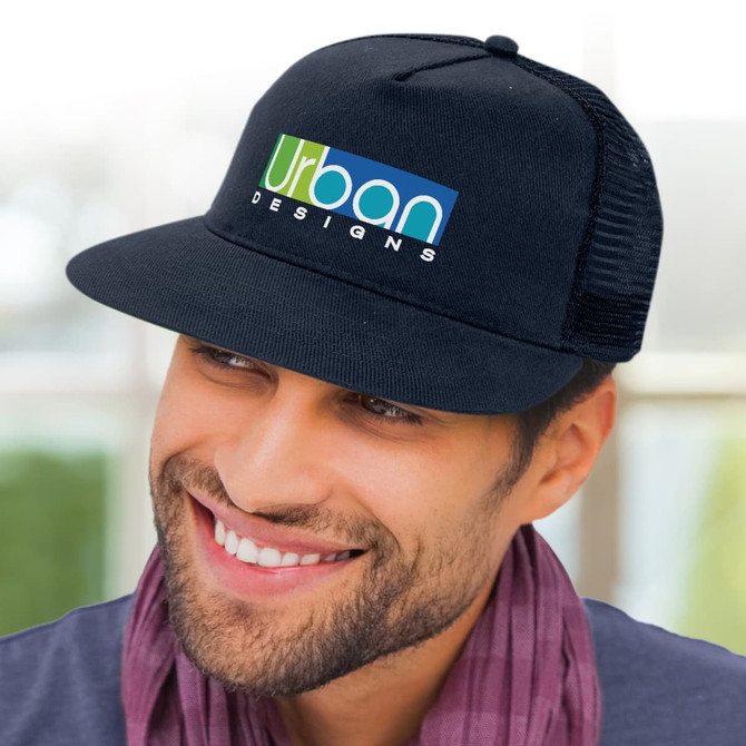 A black trucker cap with a mesh back and a logo on the front, worn by a smiling man.