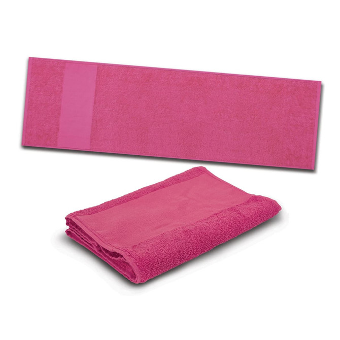 A pink Enduro Sports Towel laid flat and folded, featuring a textured surface and a logo.