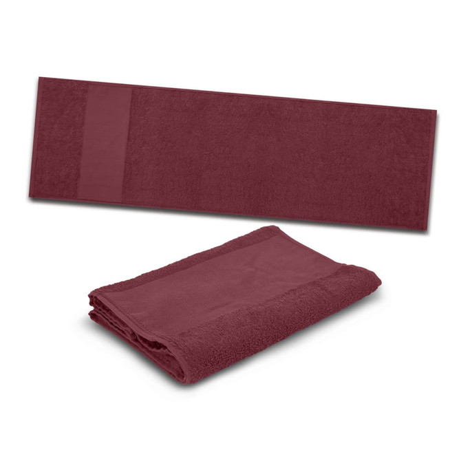 A maroon gym towel featuring a folded design and a textured strip on one side, with a logo visible.