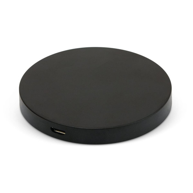 A round black wireless charger with a USB-C port visible on the side. It features a simple and sleek design.
