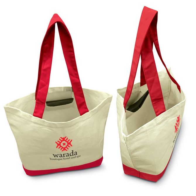 A canvas tote bag featuring a cream exterior with bright red handles and trim, along with a logo on the front.