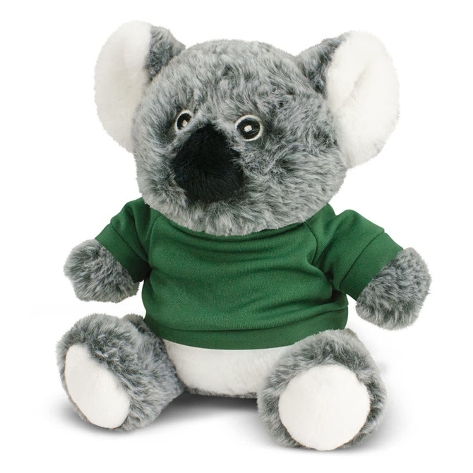 A plush koala toy in grey and white, wearing a green shirt, with round eyes and soft fur. It features a branding logo.