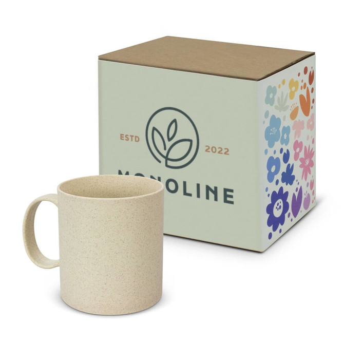 A coffee mug in a light beige colour, displayed next to a floral-patterned box featuring a logo.