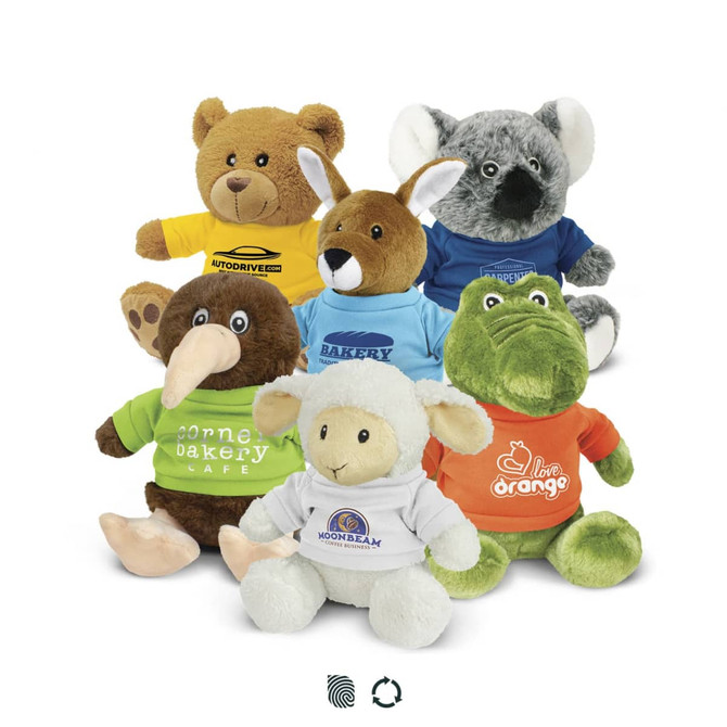 A collection of assorted plush toys in various colours, including a bear, koala, kangaroo, kiwi, sheep, and crocodile, each wearing shirts.