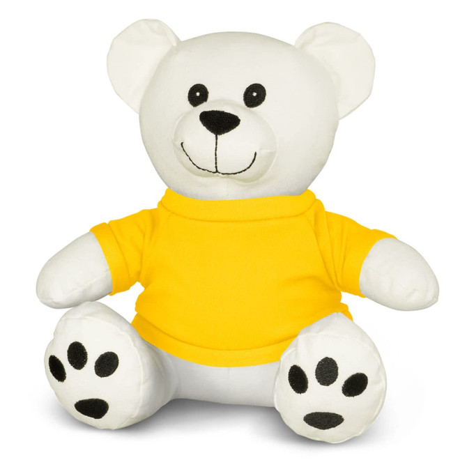 A white plush bear wearing a yellow shirt, featuring black paw prints and buttons for eyes.