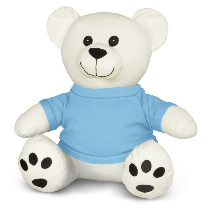 A white plush bear toy wearing a blue shirt, with black paws and a smiling face. It has a simple logo on the shirt.