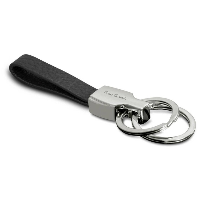 A black leather key ring featuring a silver metal clasp and two key rings, with a logo on the metal.