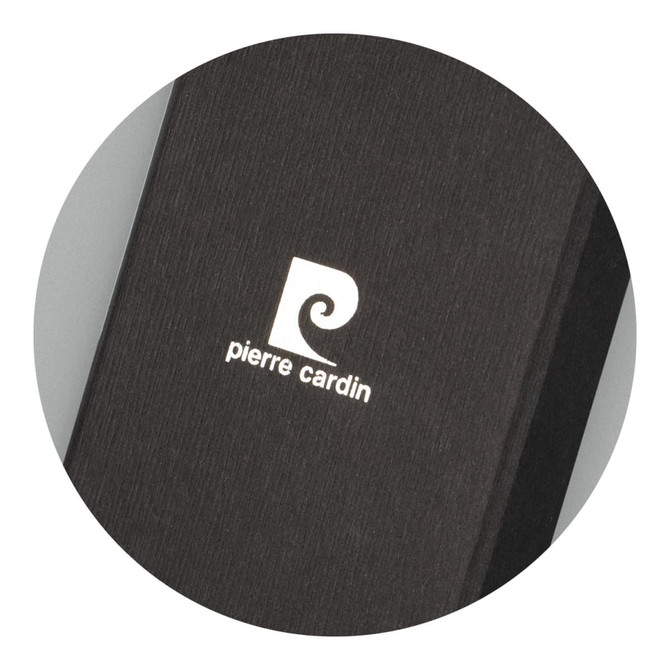 A black key ring with a textured finish and a white logo on its surface.