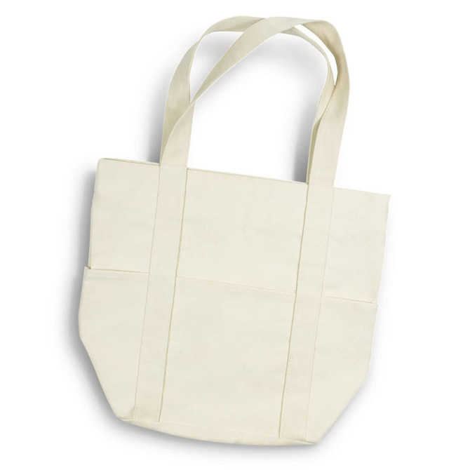 A cream canvas tote bag with two side pockets and long handles. It has a minimalist design and a logo.