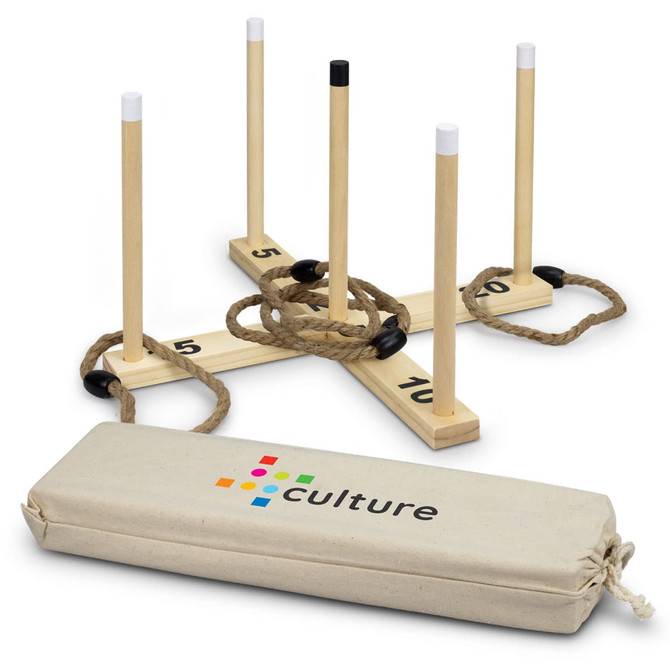 A wooden ring toss game featuring four pegs and a rope, with a beige carrying bag that has a logo.