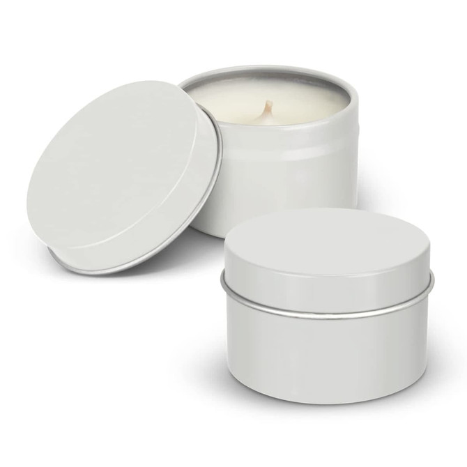 A set of two silver travel candles in metal tins, one with an open lid revealing a cream-coloured wax.