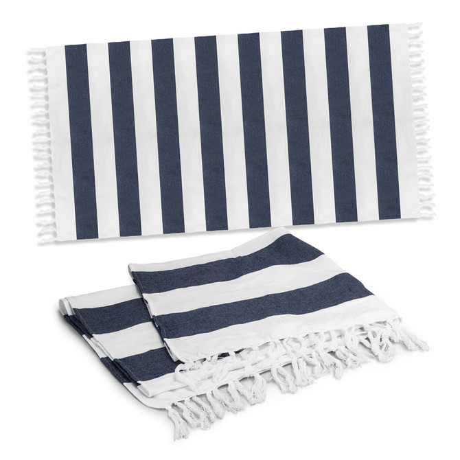 A striped Okana cotton towel in navy blue and white, featuring fringed edges, displayed flat and folded.
