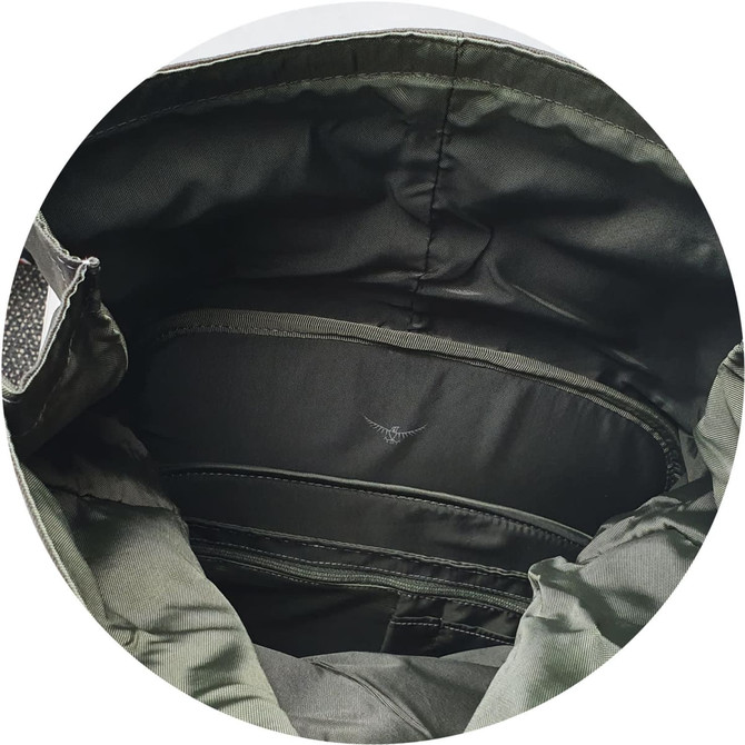 An interior view of a green Osprey Arcane Roll Top Backpack, showcasing its storage compartments and lining.