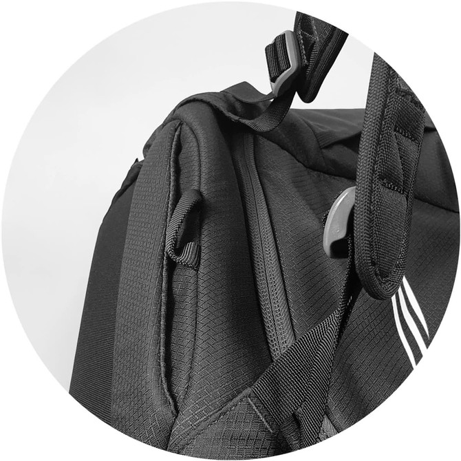 A black duffle bag featuring textured fabric and adjustable straps, with a logo present.