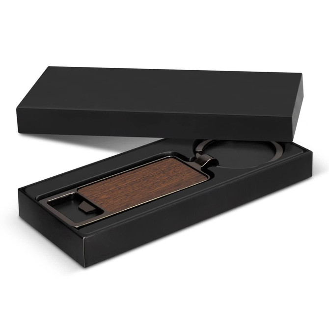 A drink bottle opener key ring with a wooden insert, presented in a sleek black box.