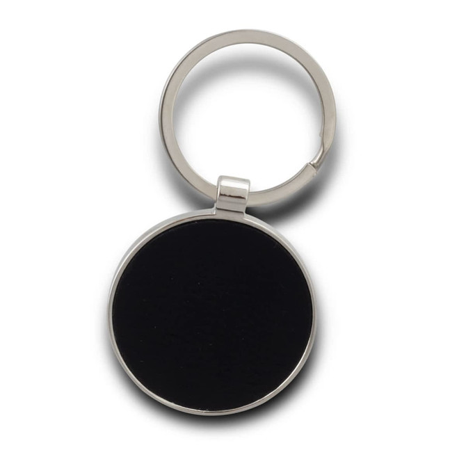 A round key ring in silver with a black centre, featuring a metallic finish.