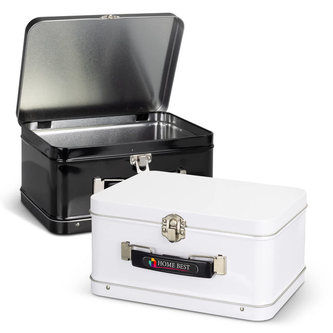 A black and a white tin lunch box with metal clasps and an interior lining, both featuring logos on the exterior.