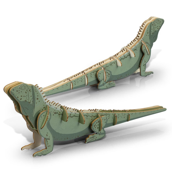 A green and natural wooden model of a tuatara, featuring intricate cut-out details and a creative design.
