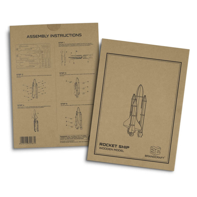 Assembly instructions for a wooden rocket ship model. The packaging features a brown background with black line drawings.