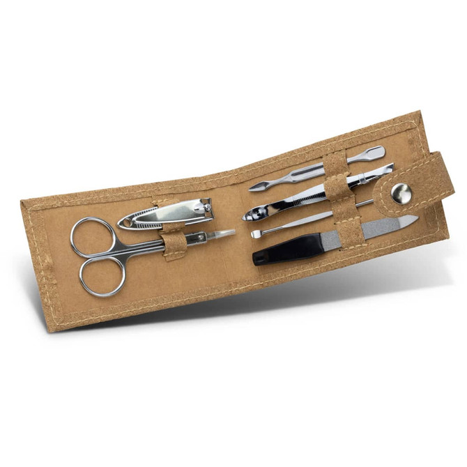 A cork manicure set featuring stainless steel tools, including scissors, clippers, and a cuticle pusher, in a natural cork case.