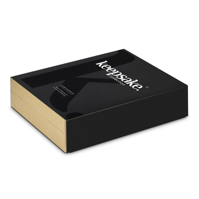 A black and gold rectangular box with a logo, containing a cocktail set for home use.