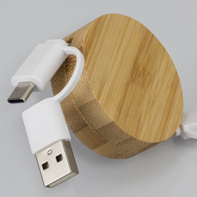 A bamboo retractable charging cable with white connectors, featuring a circular bamboo casing.