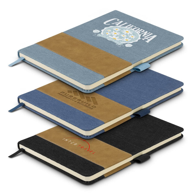 A collection of three denim notebooks in blue, black, and beige, each featuring a logo on the cover.