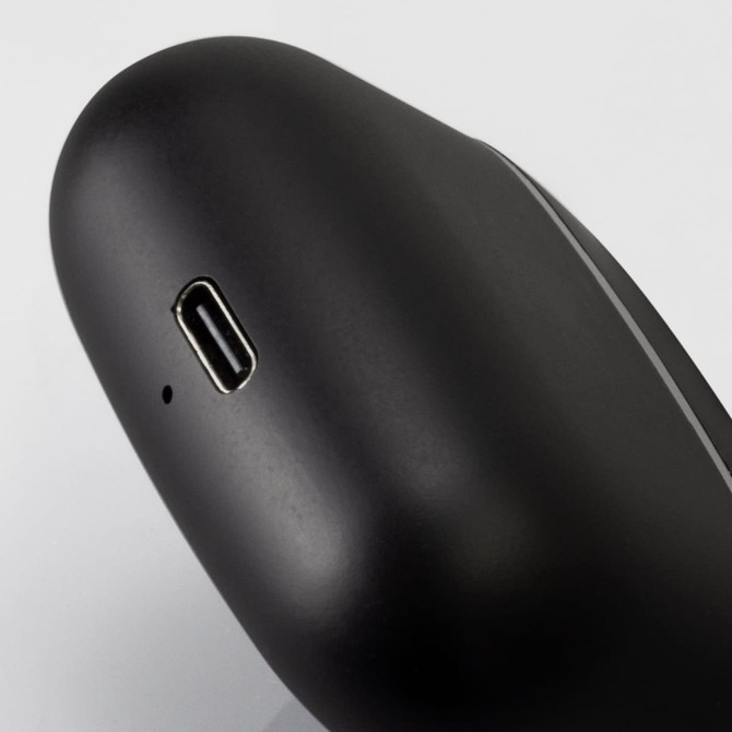 A pair of black TWS earbuds with a charging port, featuring a sleek design and a branding logo.